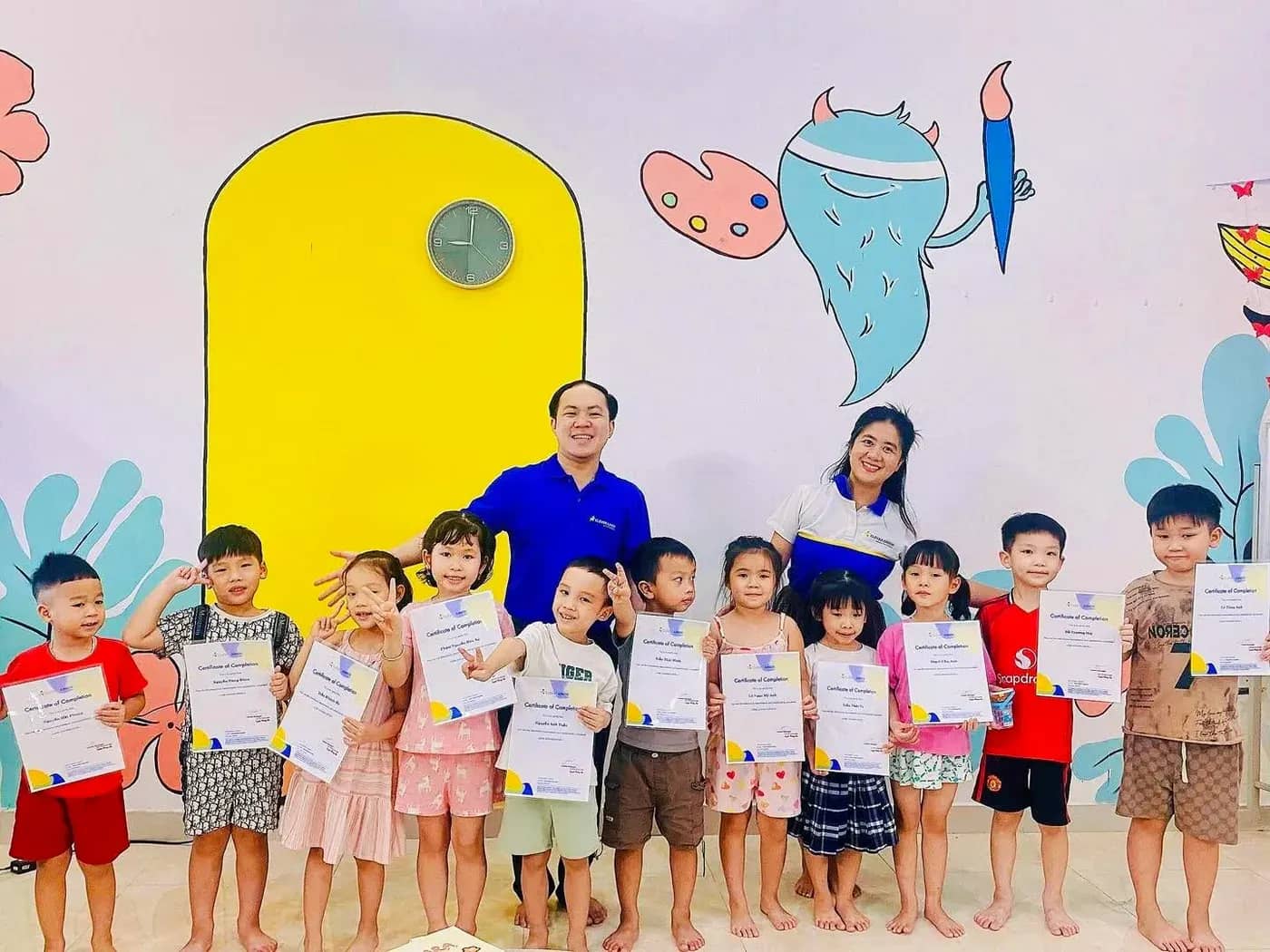 A whole class receiving end-of-course certificates