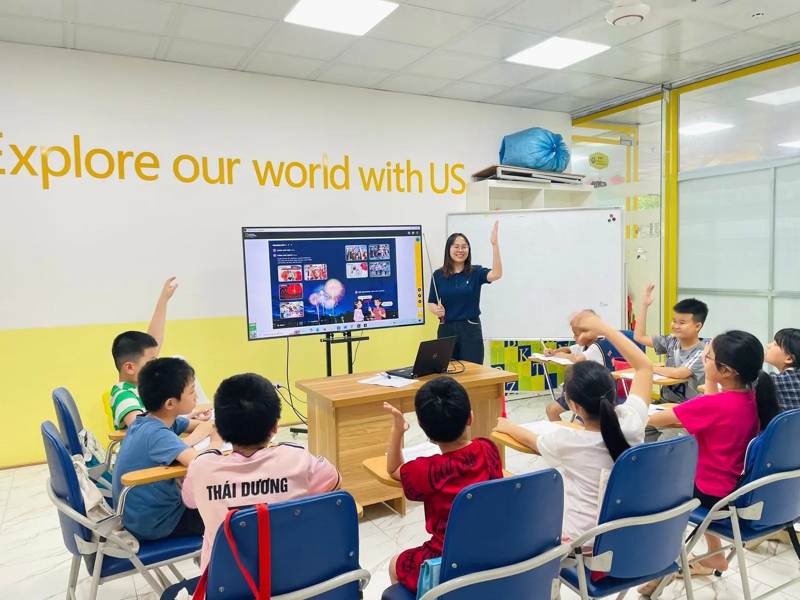 An Explore Our World class with their teacher